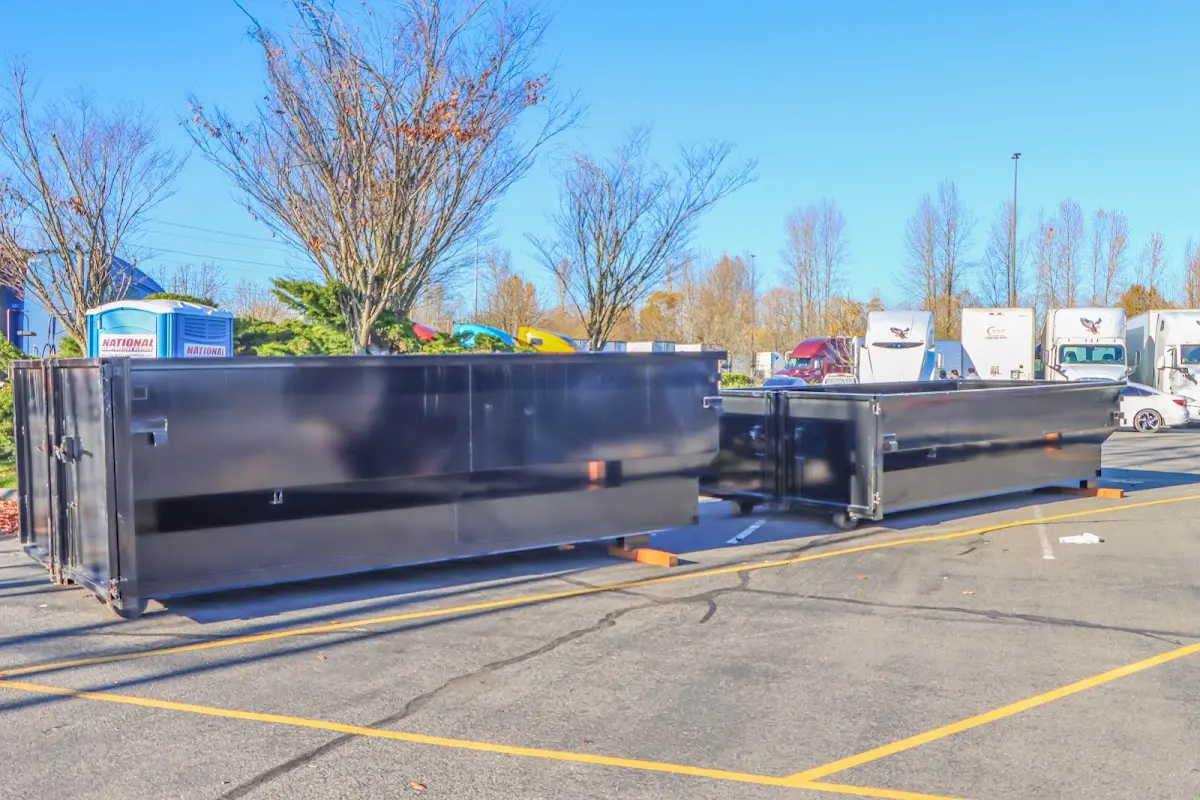 Professional dumpster rental service with roll-off container on residential driveway in Richland Hills